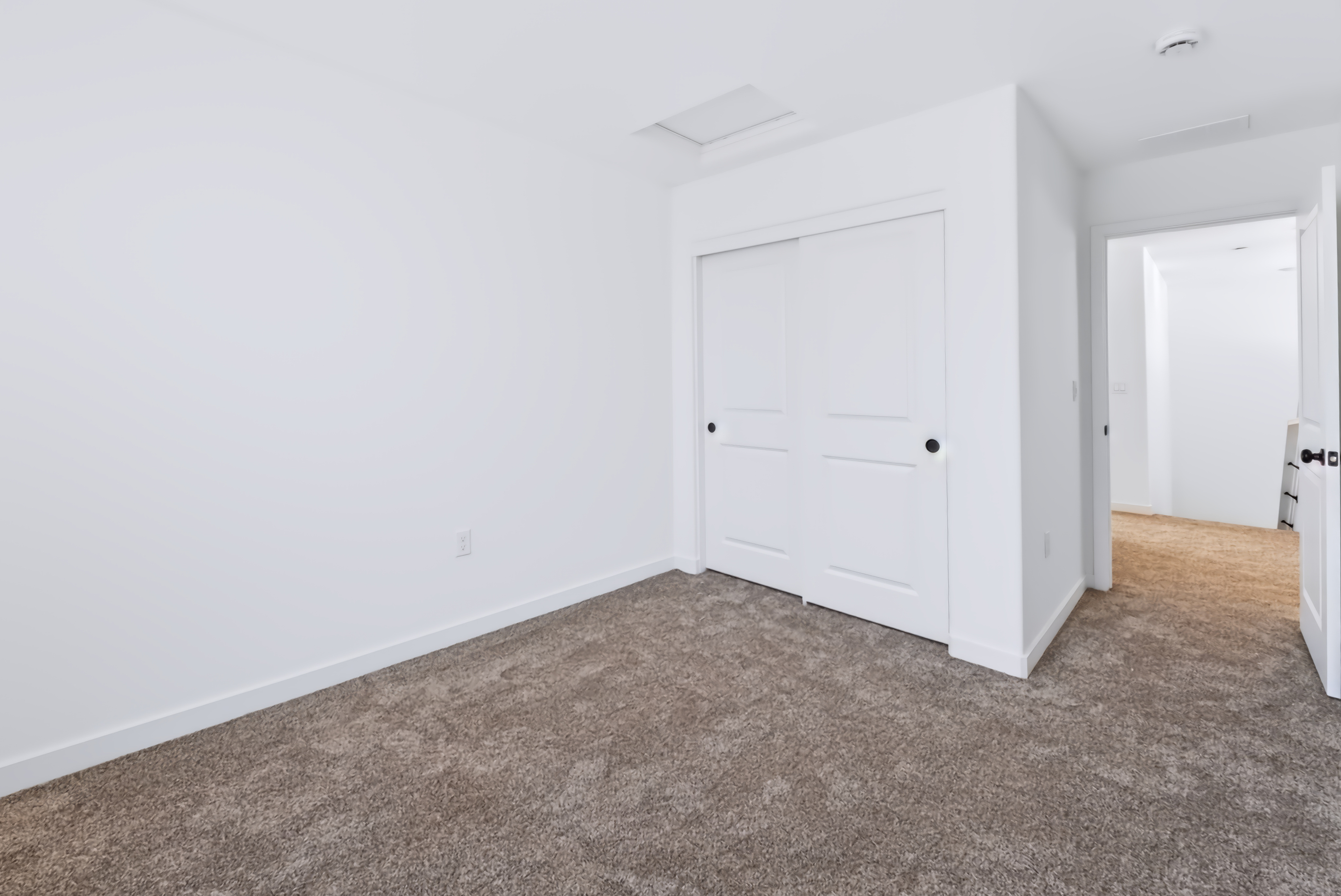 A room with white doors.