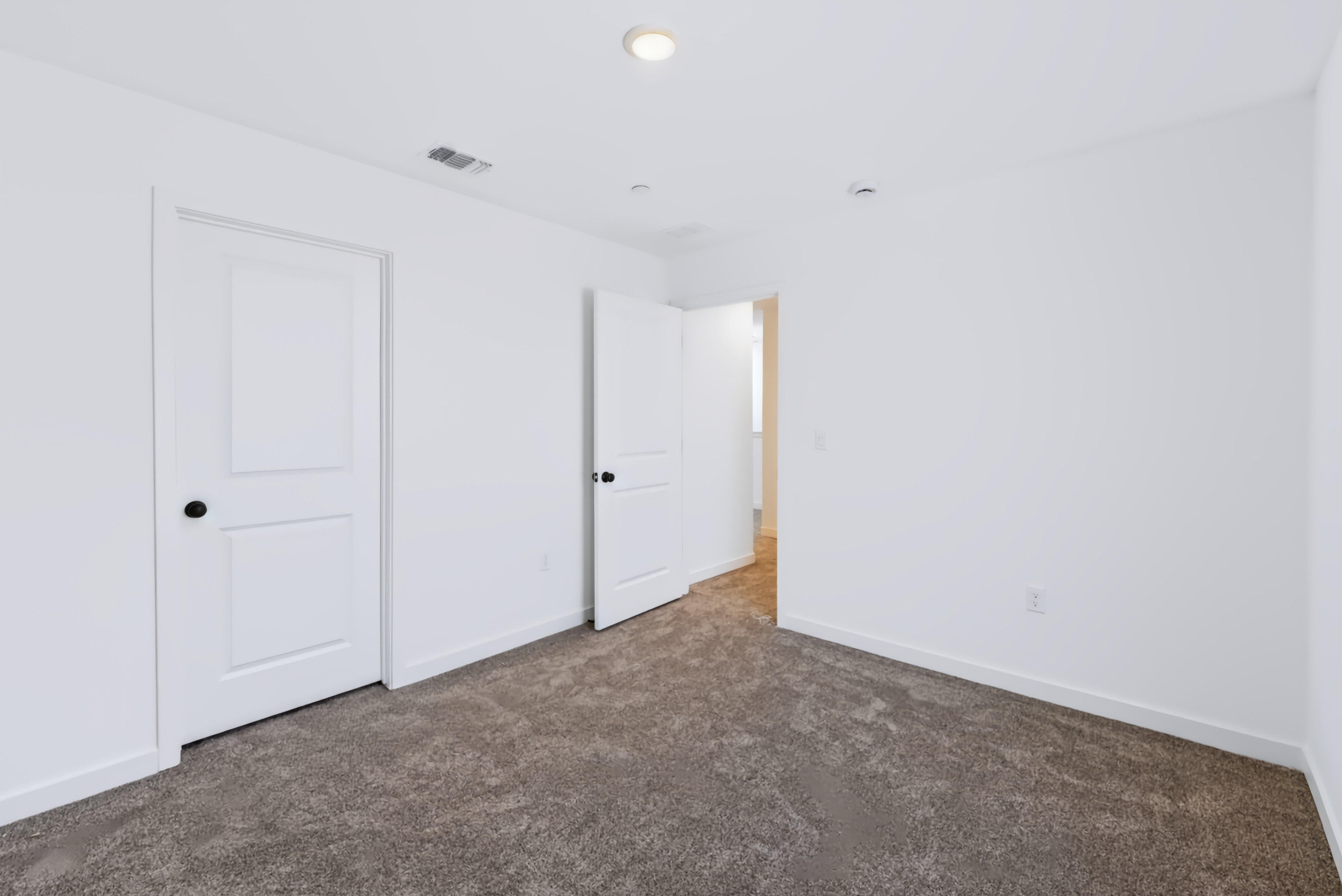 A room with white doors.