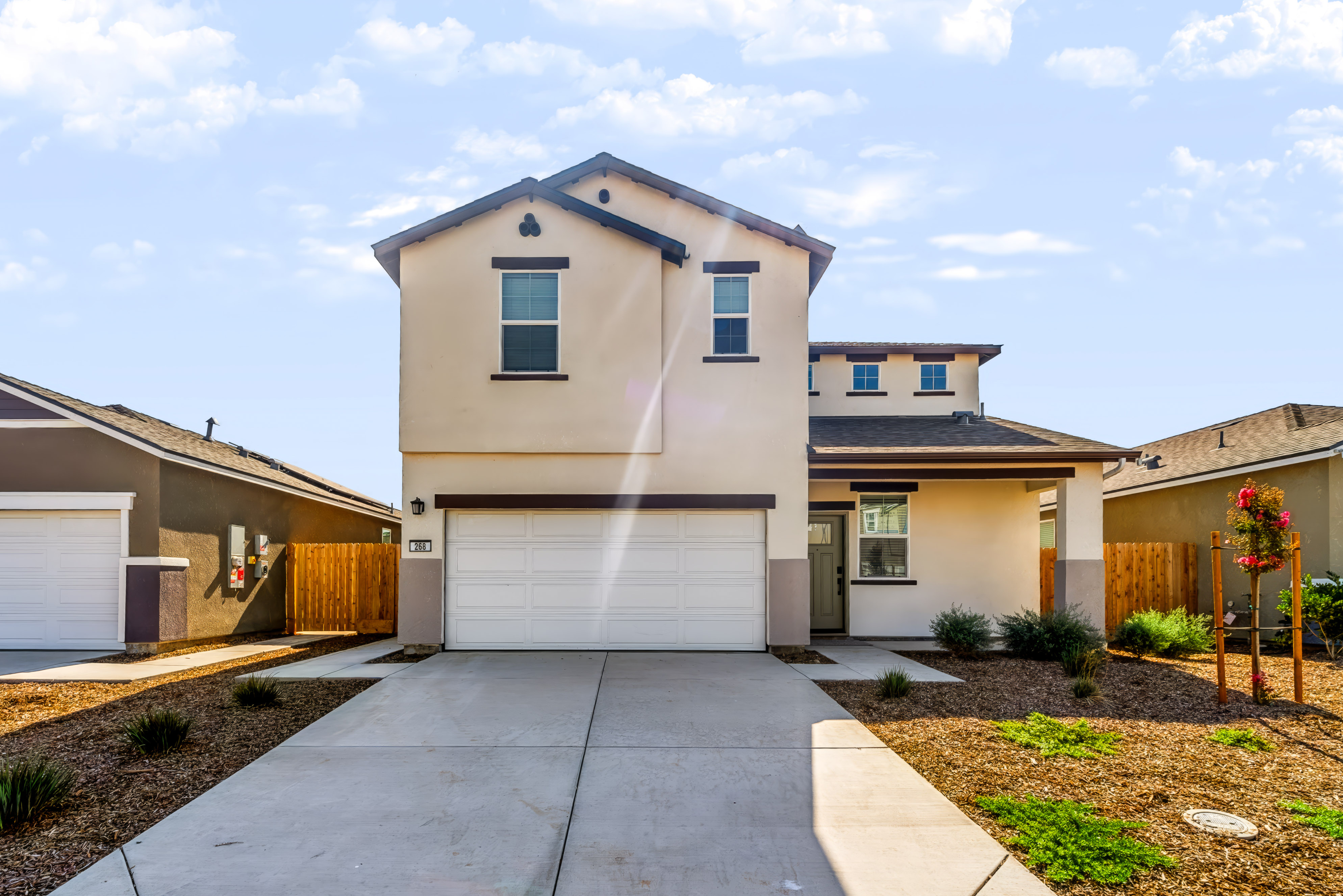 A house with garages and a driveway.
