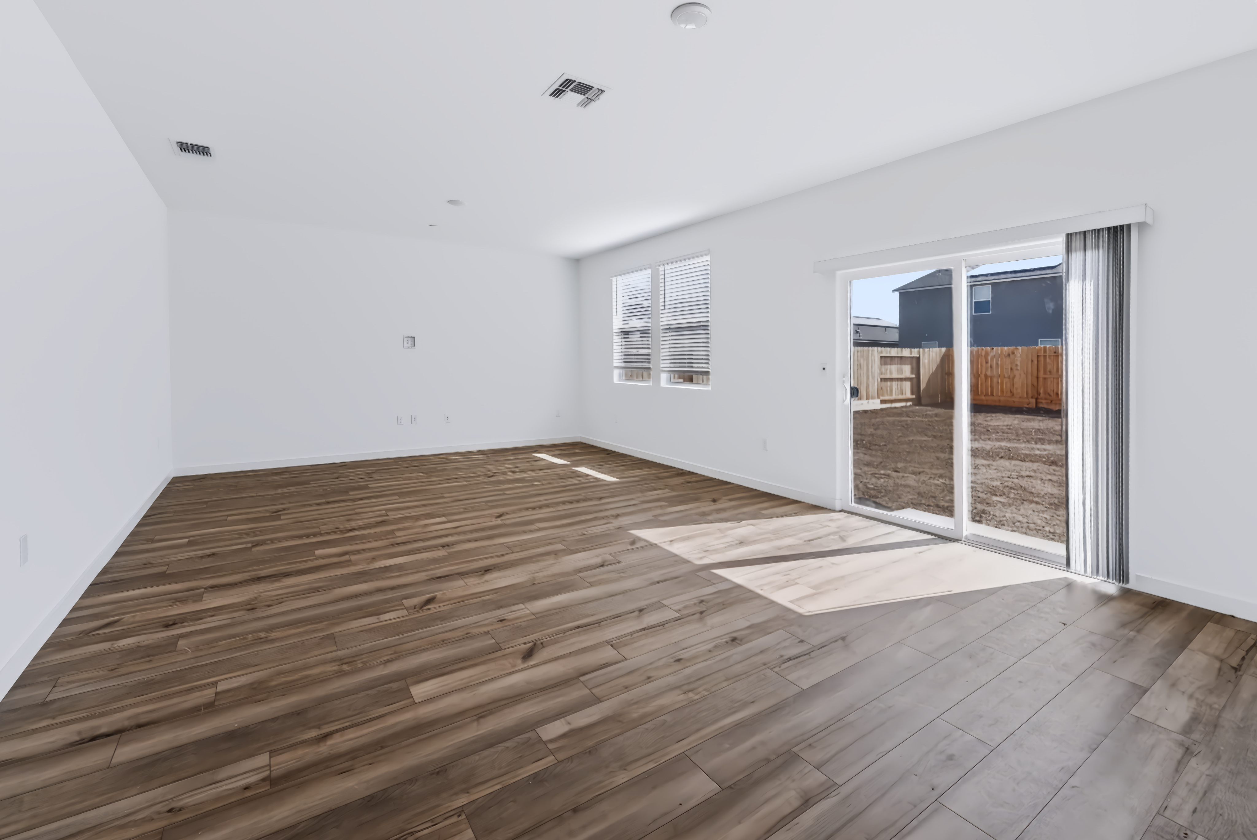 A room with a wood floor and a wood floor.