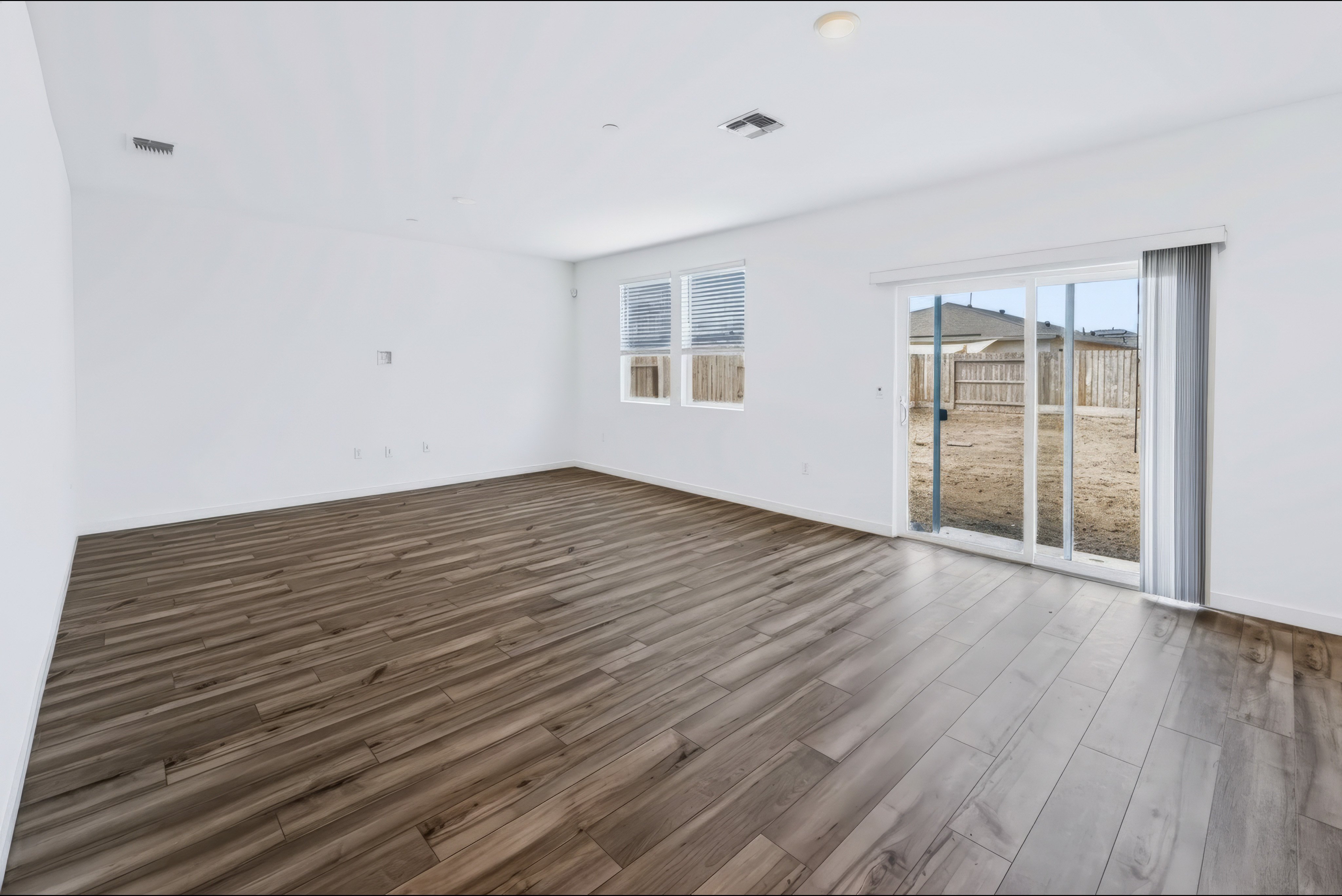 A room with a wood floor and a wood floor.