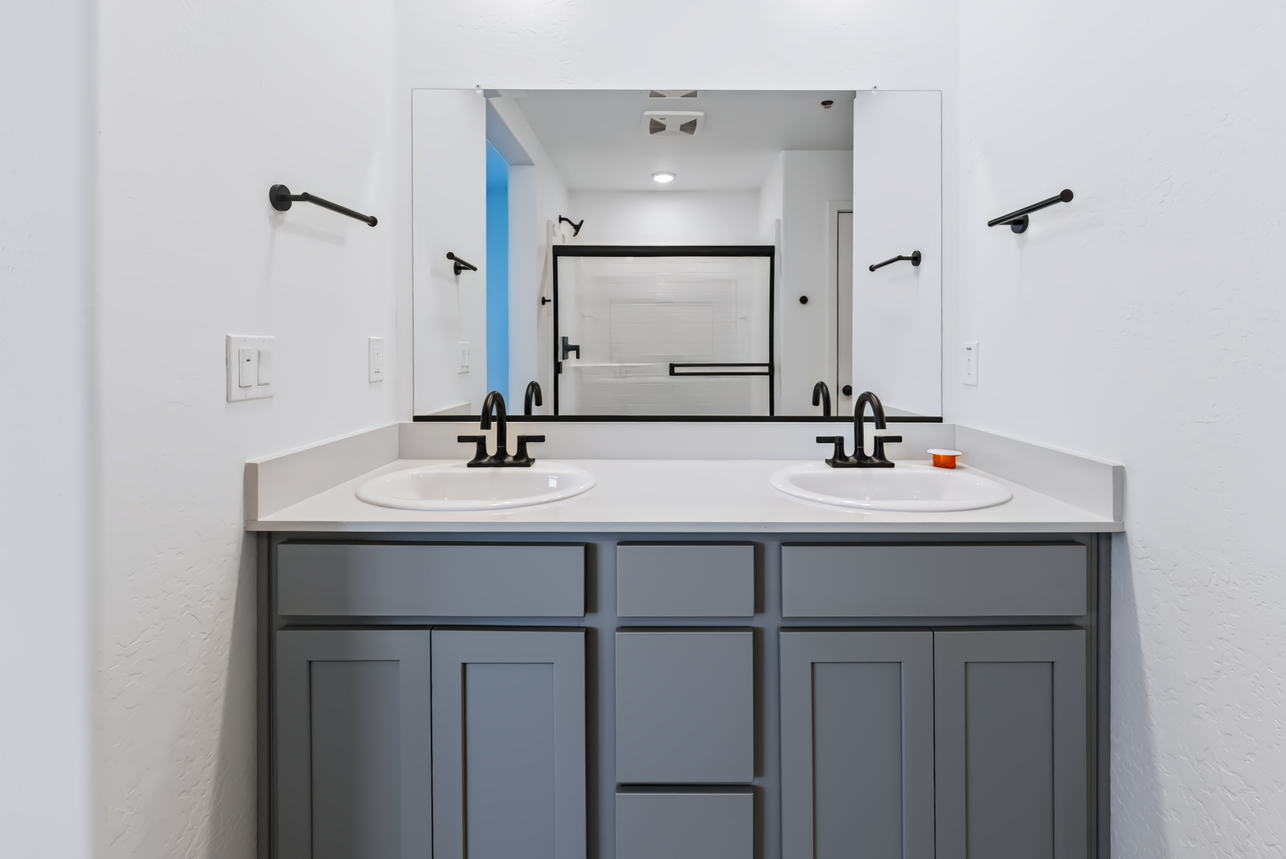A bathroom with two sinks.