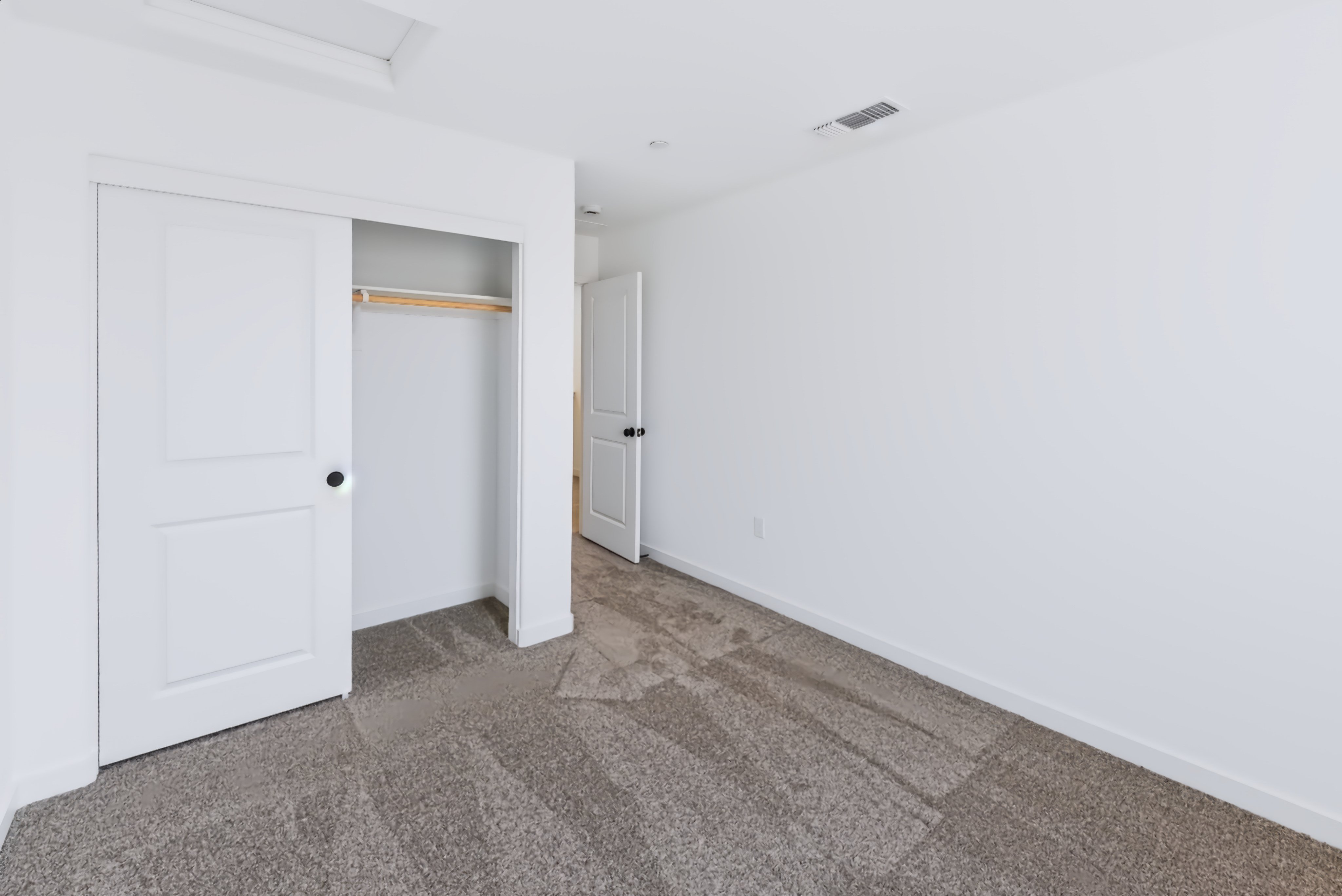 A room with white doors.