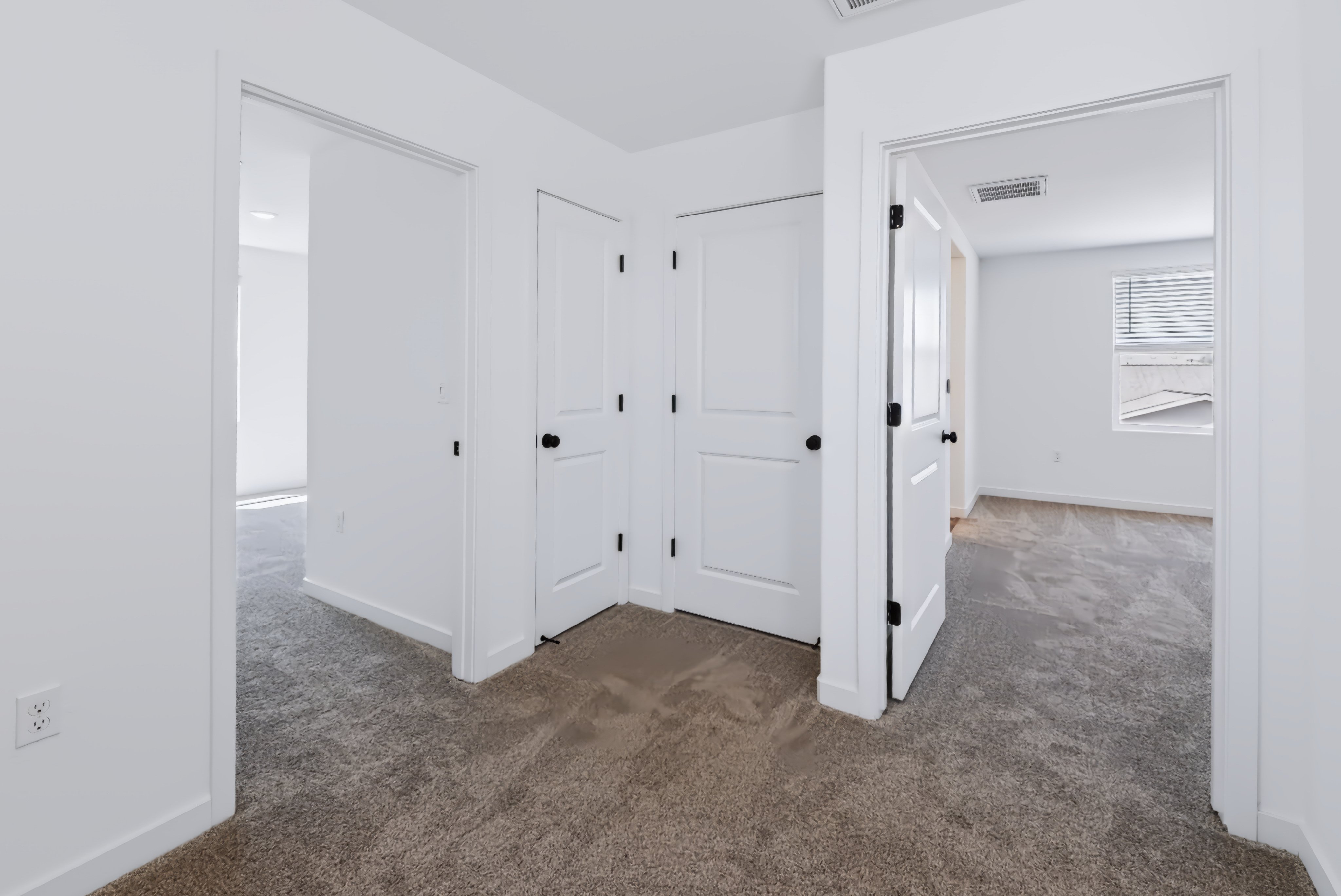 A room with white cabinets.