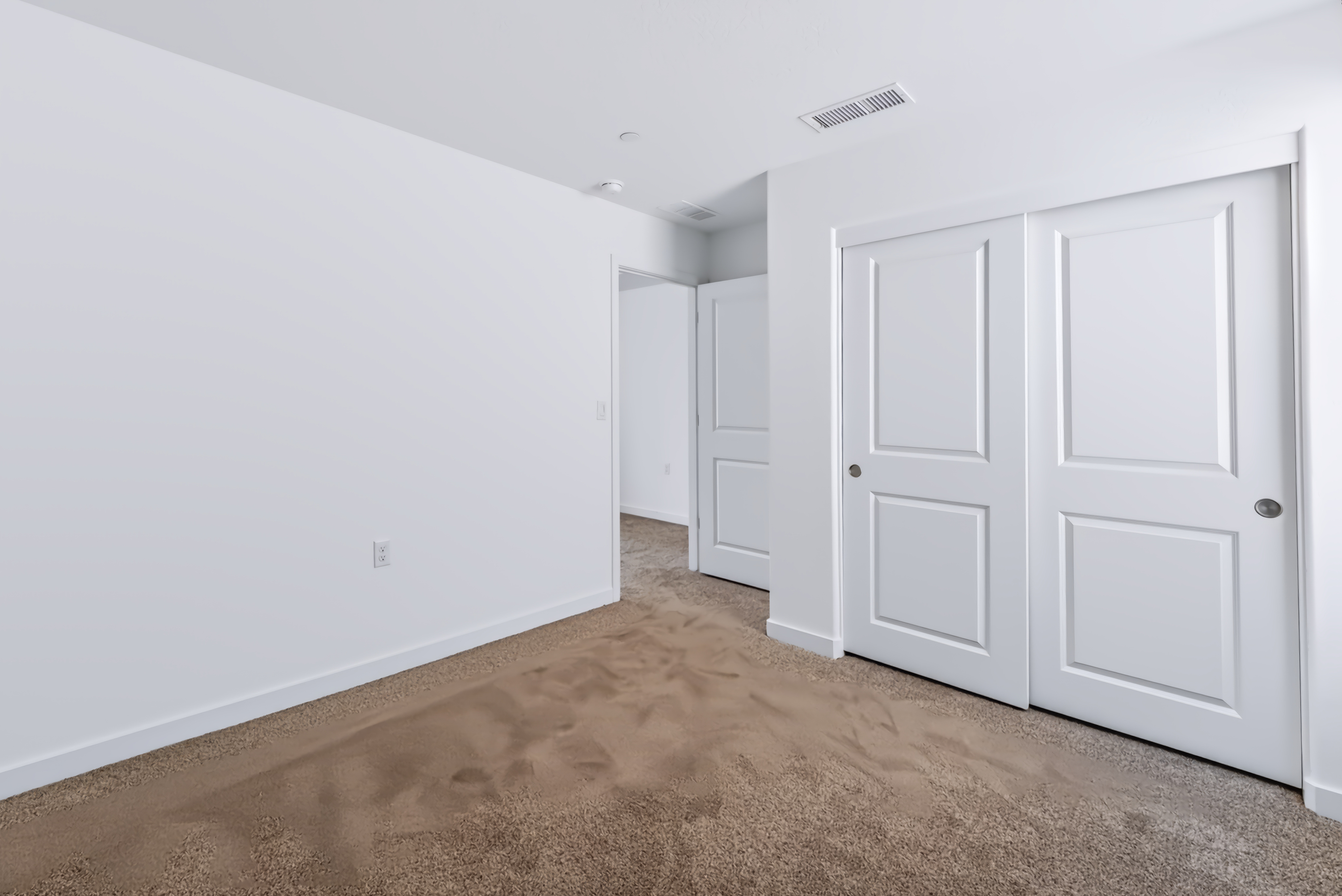 A room with white doors.