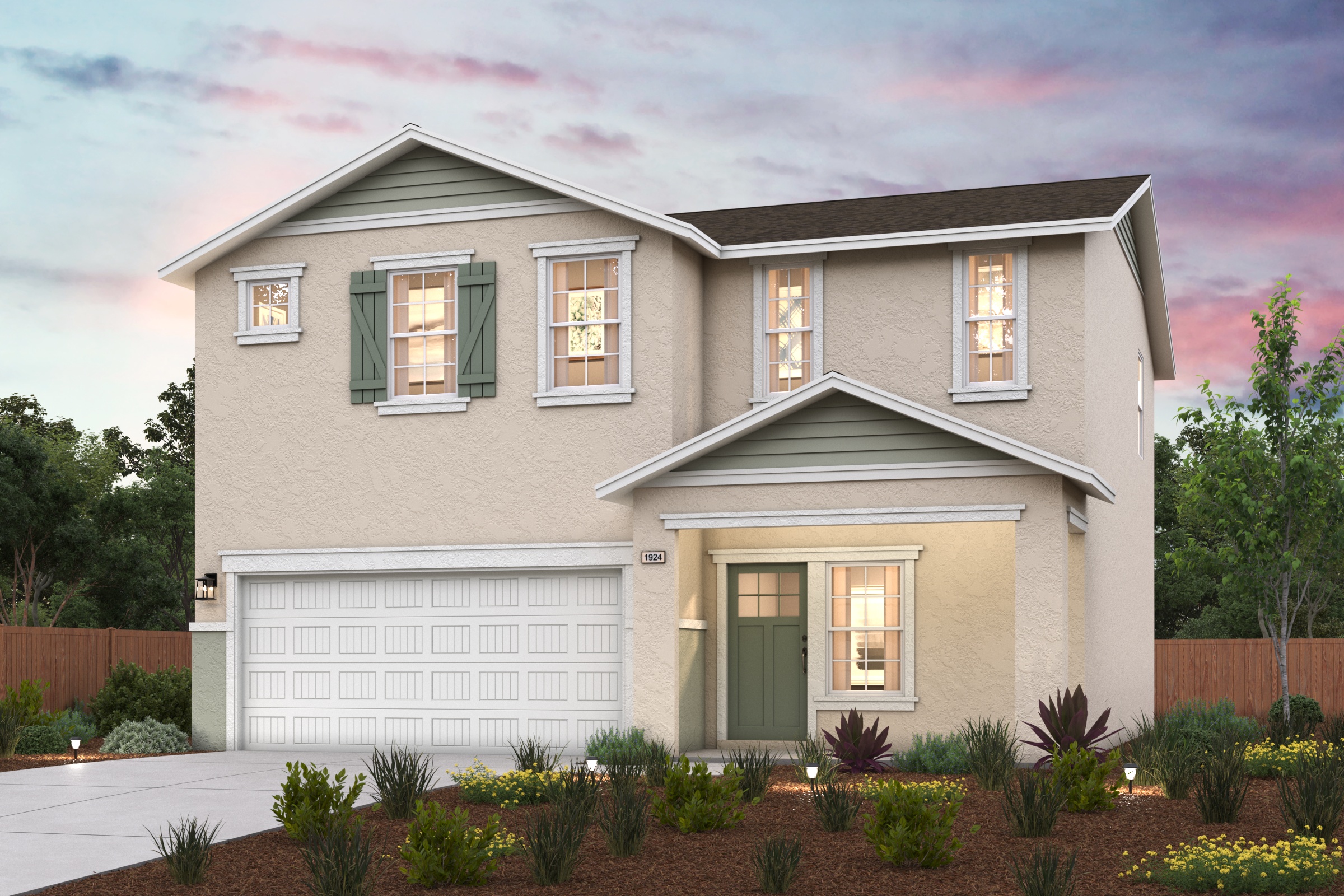 A house with a garage and bushes.