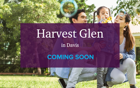 A group of people holding a purple sign.