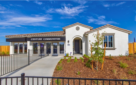 A building with a fence in front.
