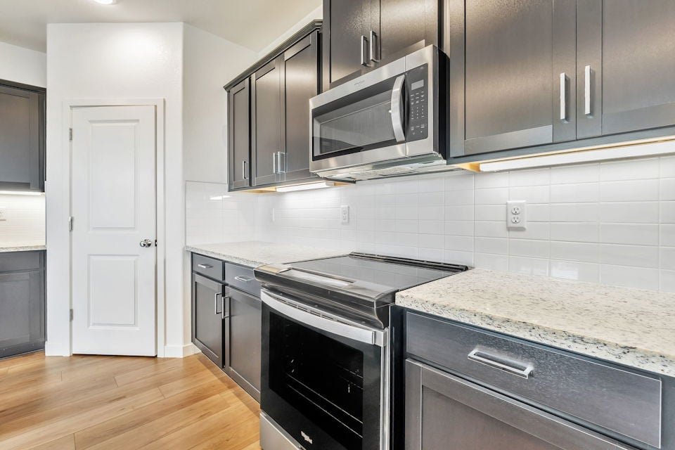 A kitchen with stainless steel appliances.