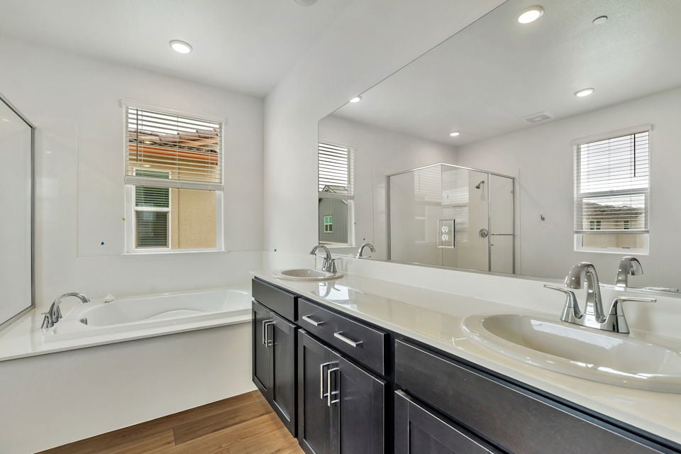 A bathroom with a large mirror.