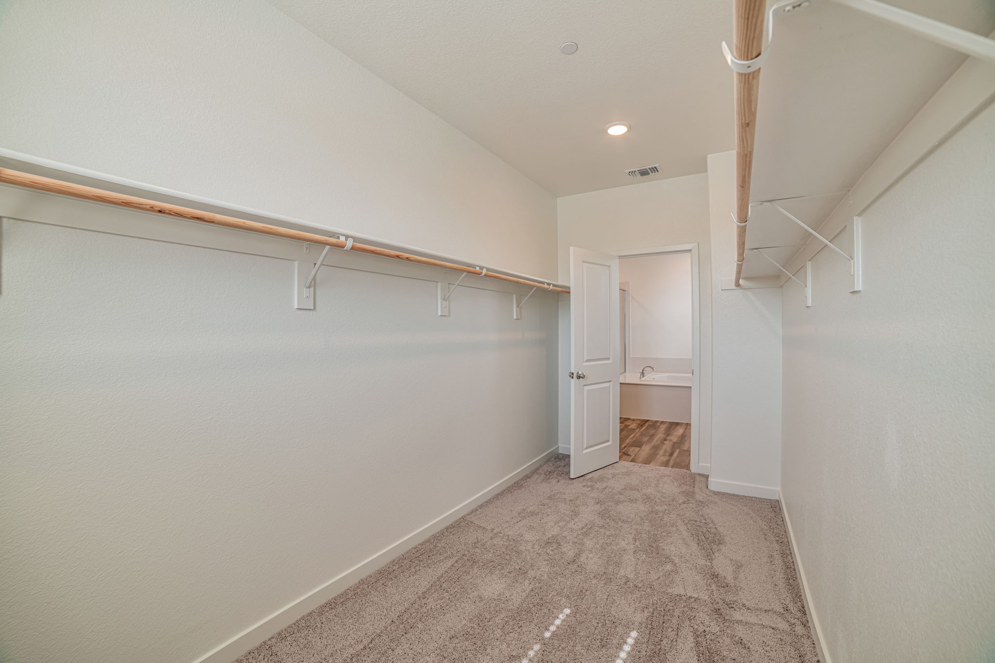 A hallway with white walls.