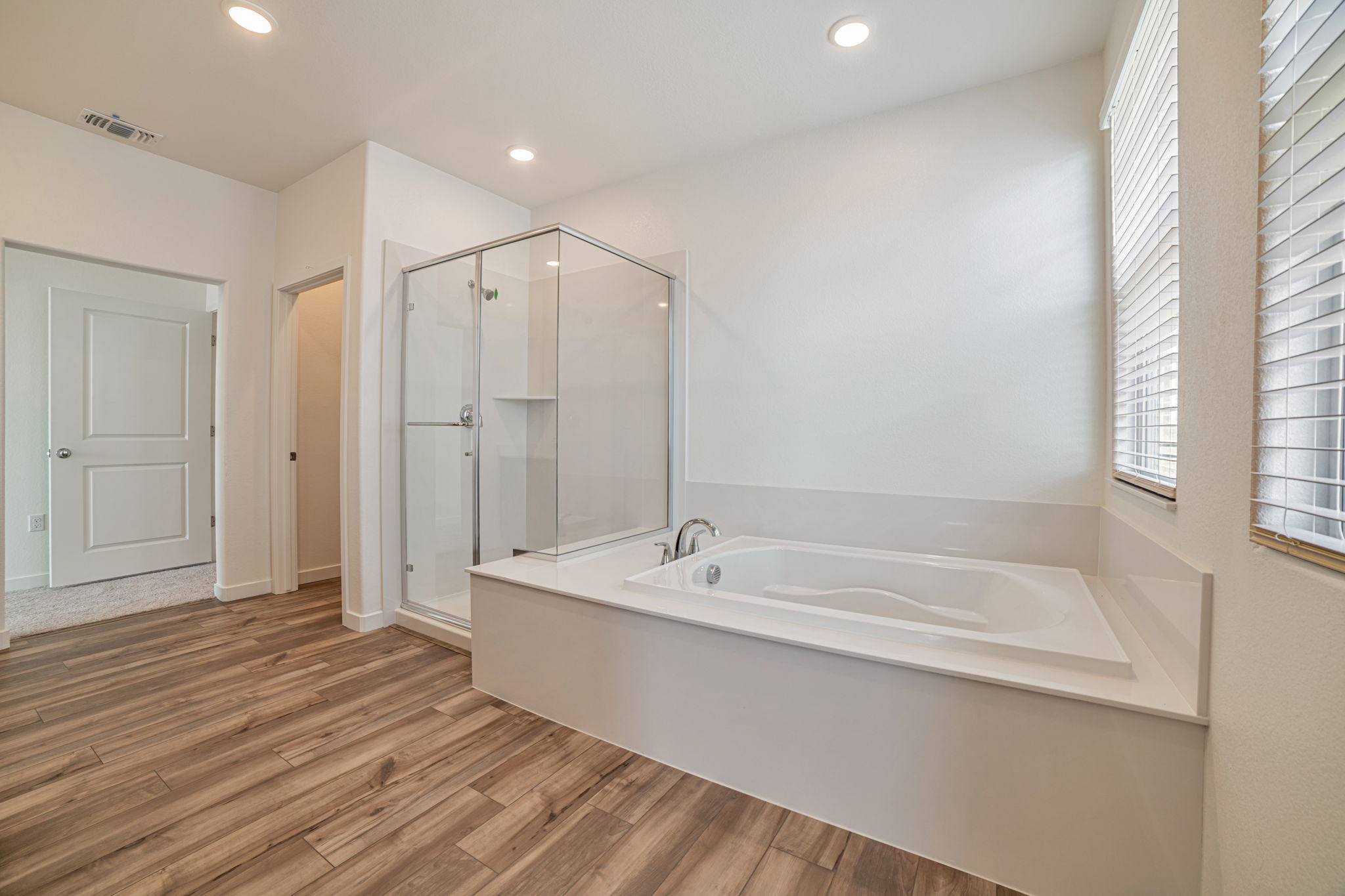 A bathroom with a tub and shower.