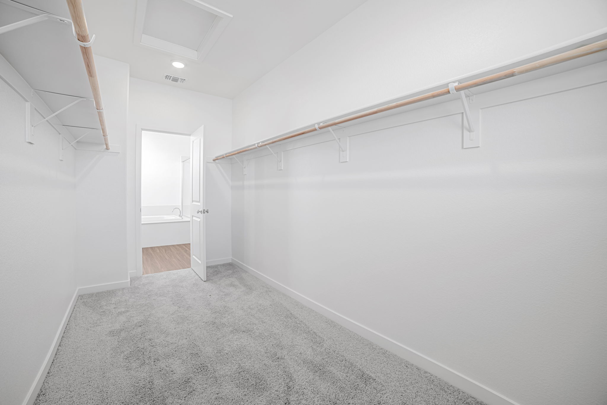 A hallway with white walls.