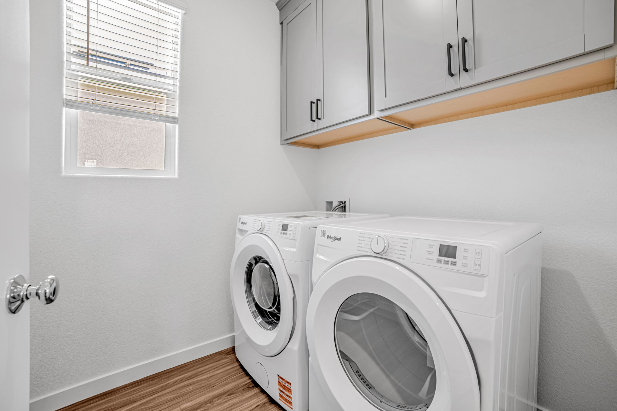 A white washing machine in a room.
