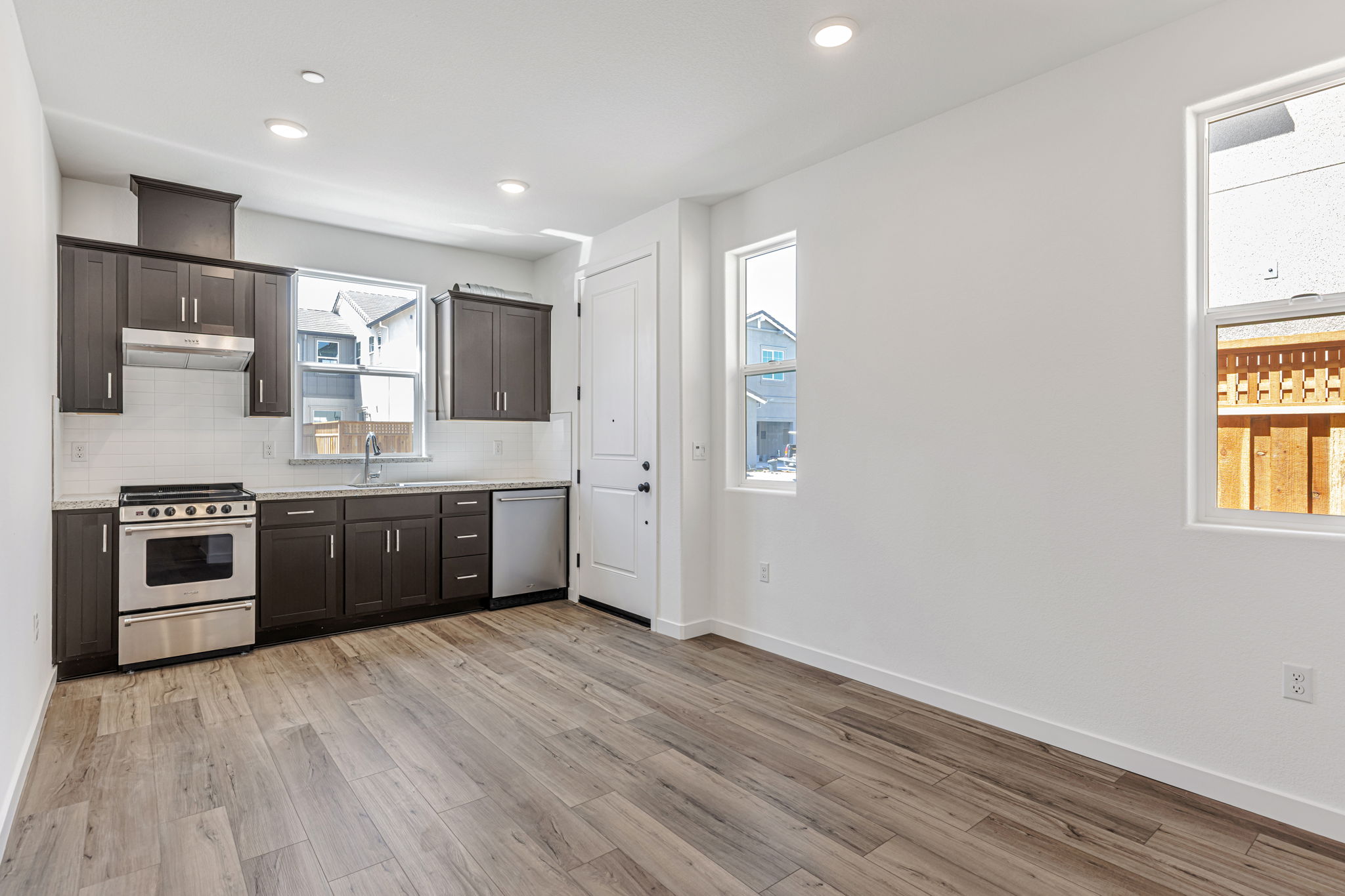 A kitchen with wooden floors.