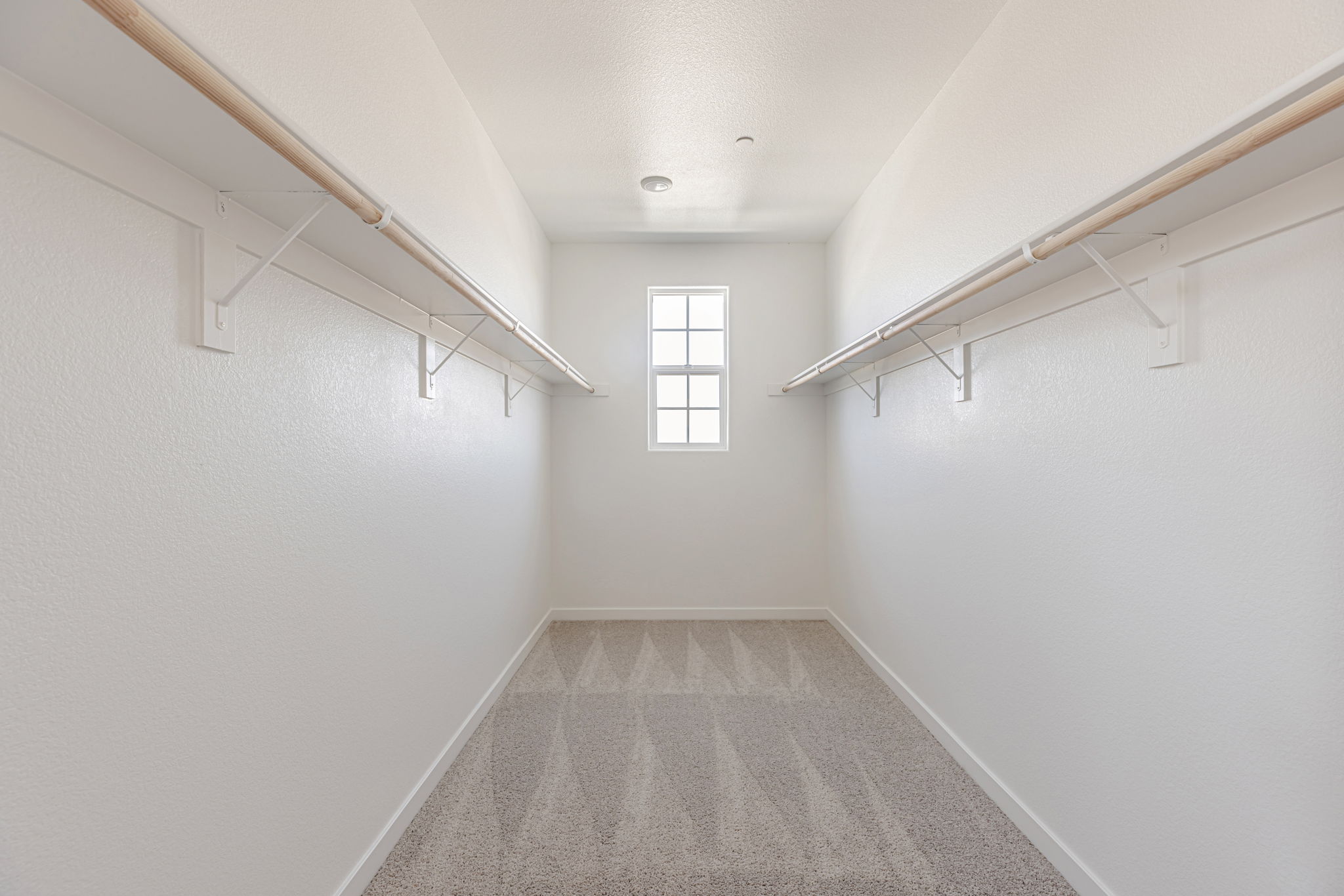 A hallway with white walls.