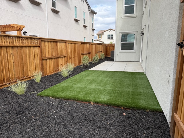 A backyard with a pool.