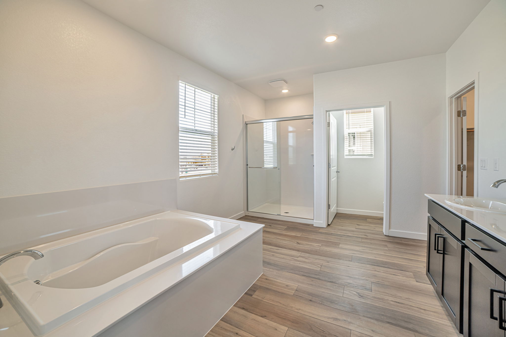 A bathroom with a tub and sink.