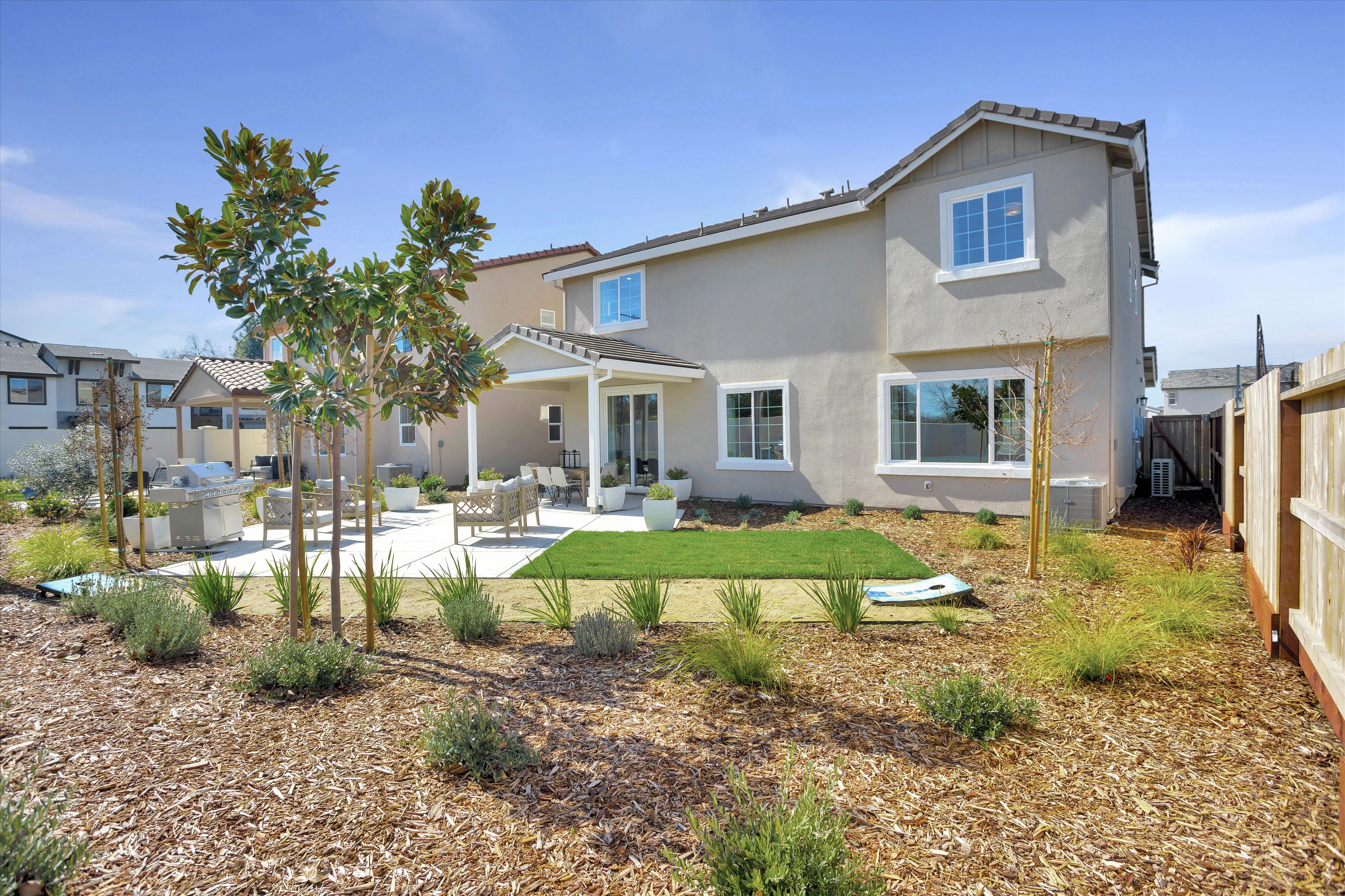 A house with a yard and trees.