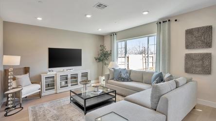 A living room with a tv and couches.