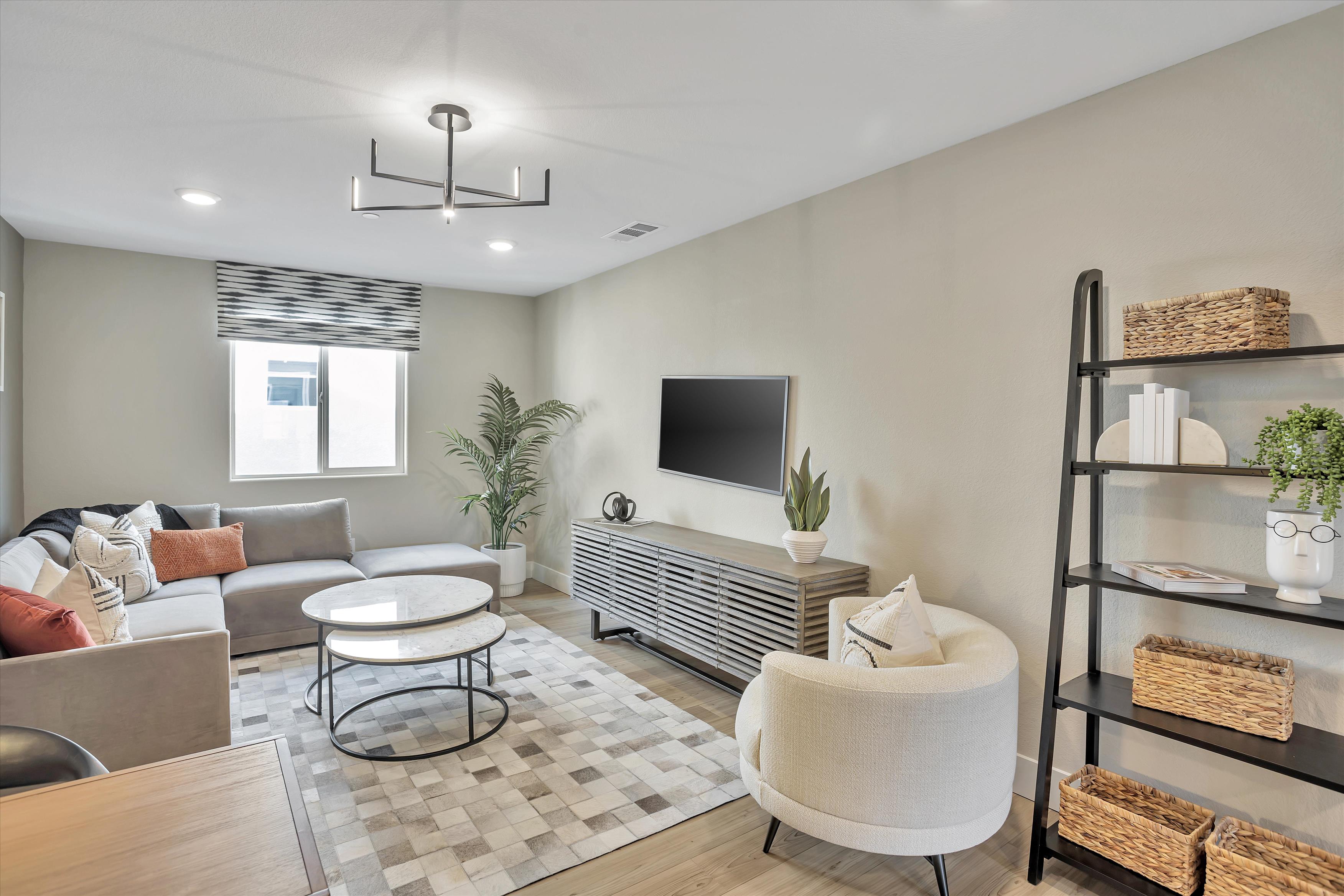 A living room with a couch and a table.