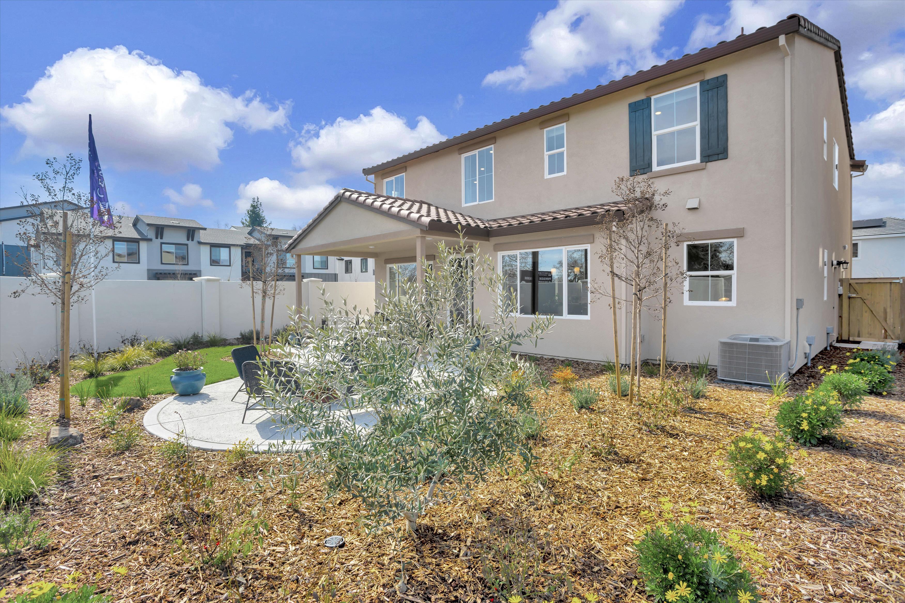 A house with a yard and trees.