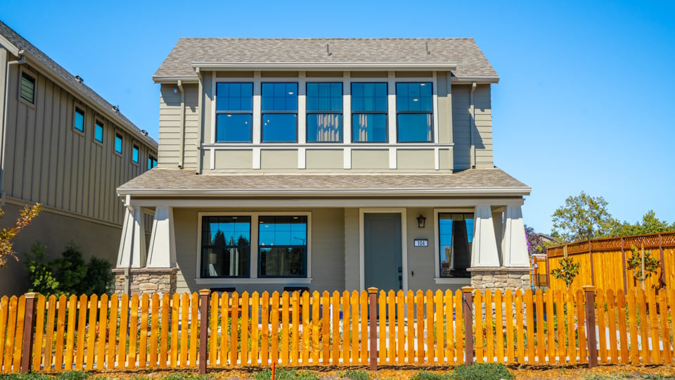 A house with a fence around it.