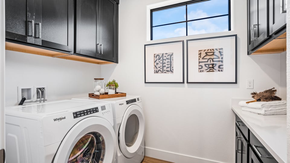 A laundry room with a washer and dryer.