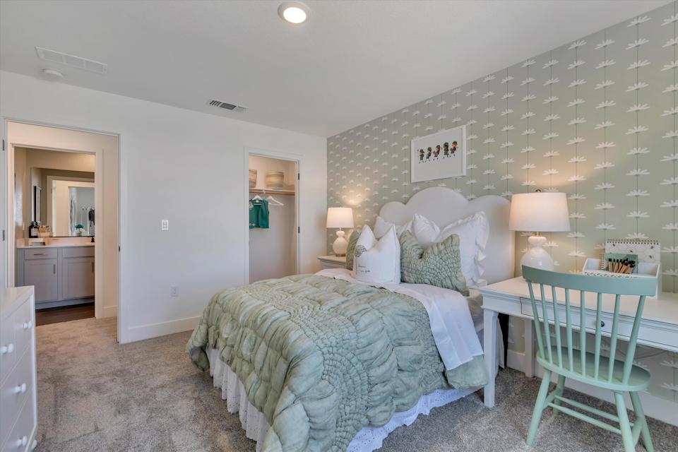 A bedroom with two beds.